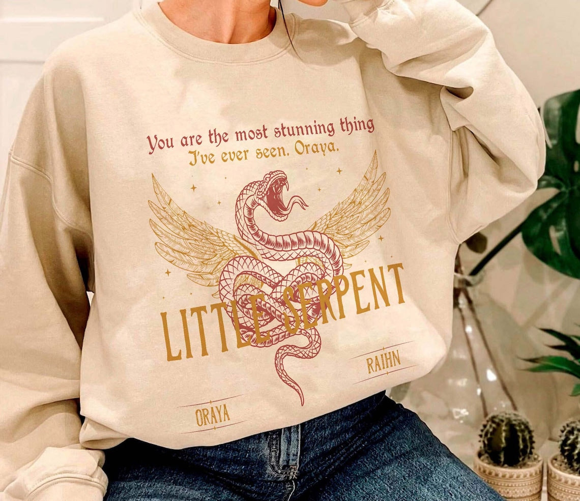 Oraya Little Serpent Sweatshirt, the Serpent and the Wings of Night Reading Sweater, Official Carissa Broadbent Merch