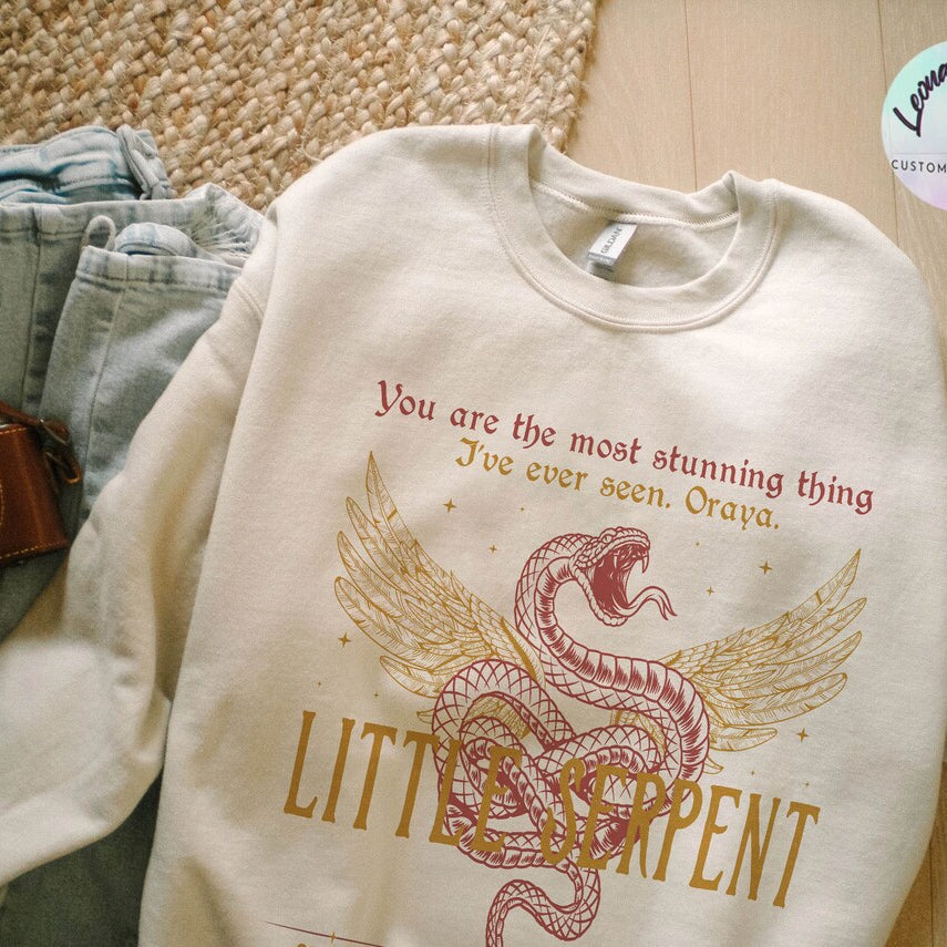 Oraya Little Serpent Sweatshirt, the Serpent and the Wings of Night Reading Sweater, Official Carissa Broadbent Merch