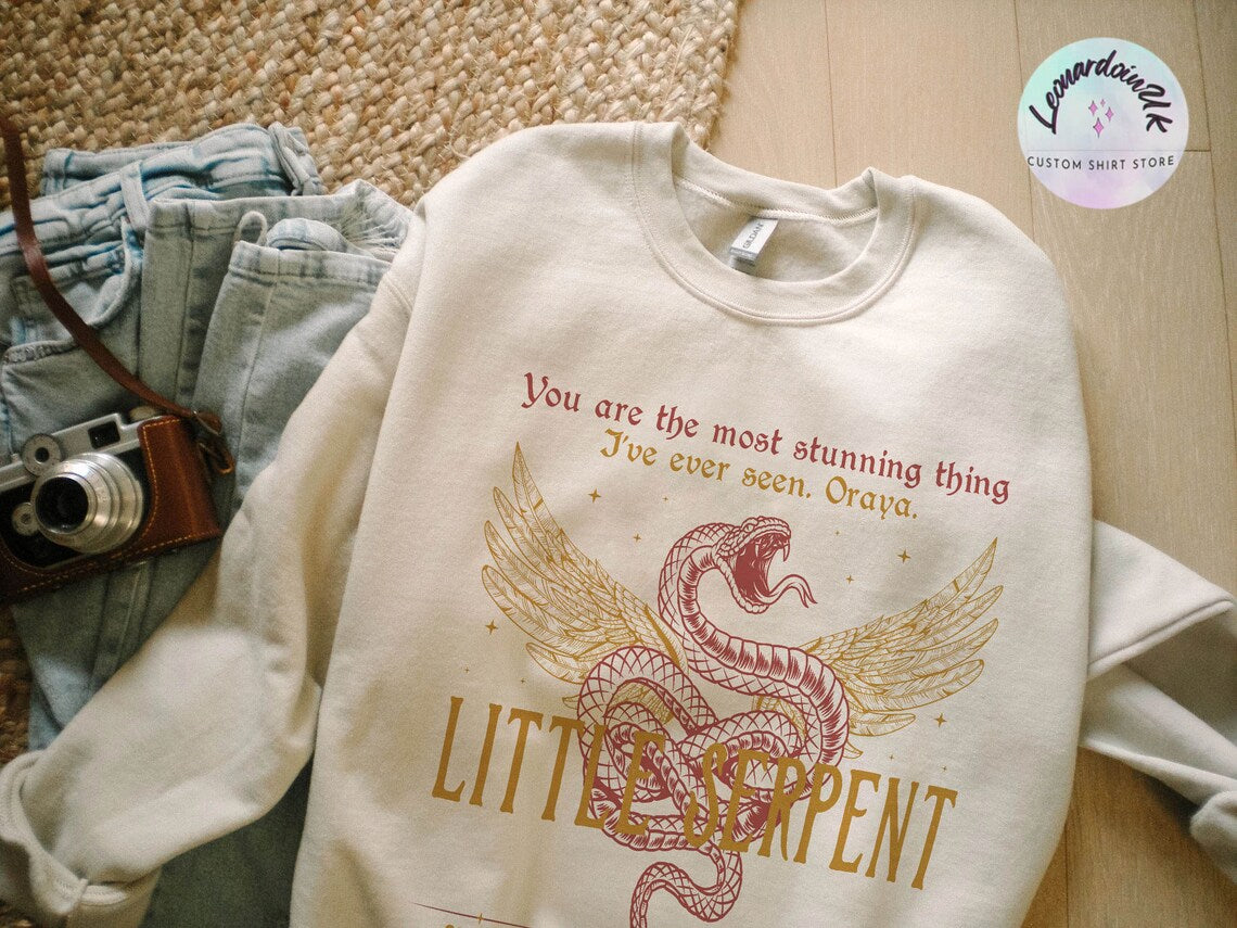Oraya Little Serpent Sweatshirt, the Serpent and the Wings of Night Reading Sweater, Official Carissa Broadbent Merch
